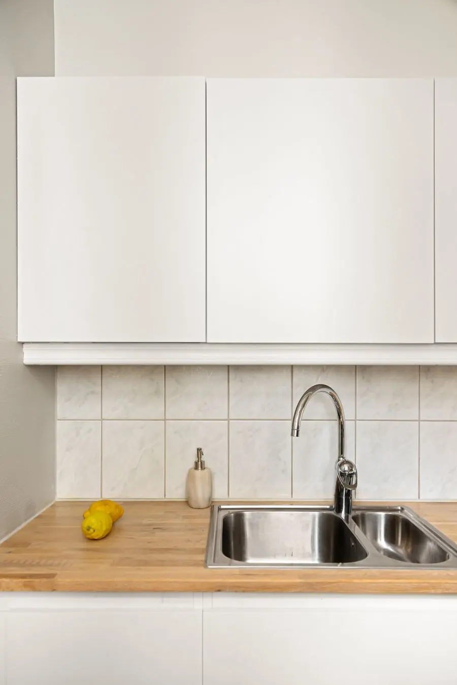 Bright modern kitchen with white cabinets